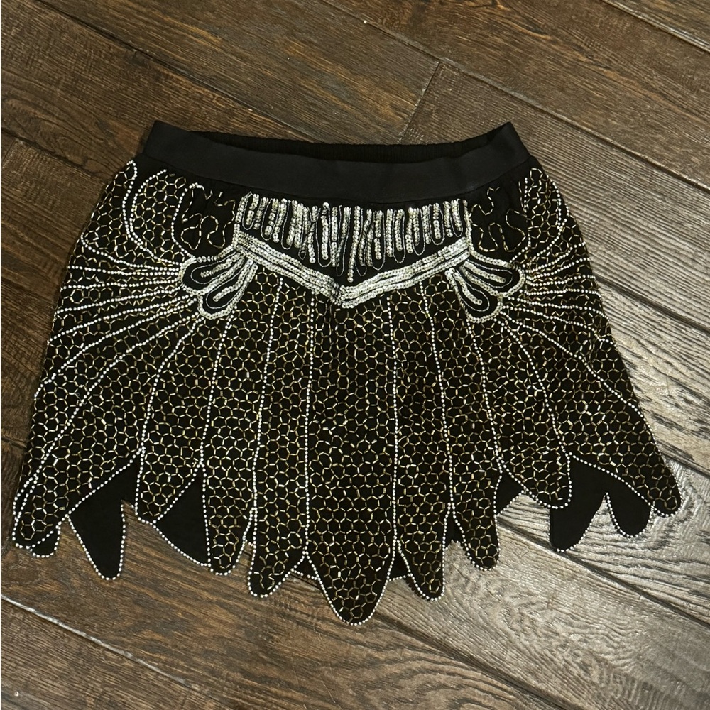 100% viscose, exclusive of sequins. It’s beautiful